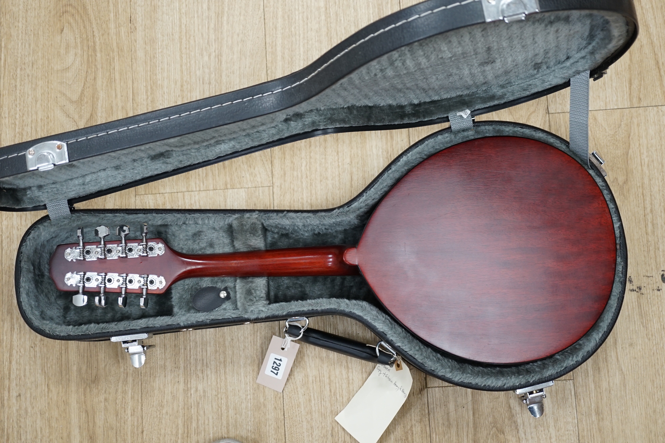 A cased 'Army and Navy' model Ozark mandolin, body length 29cm, in a good hard case